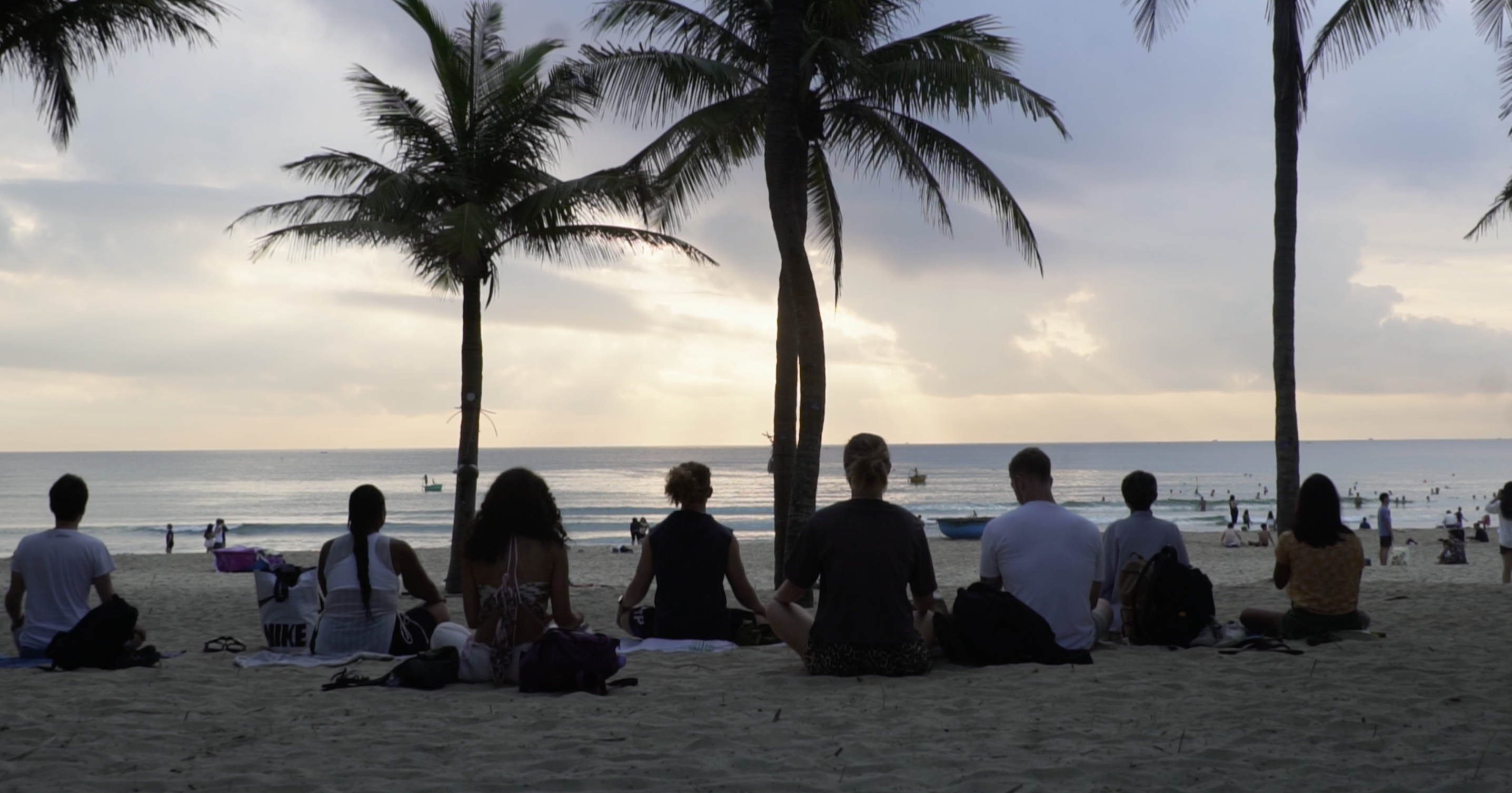 Group on the beach at sunset